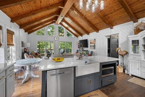 View of living area with updated kitchen and lots of seating