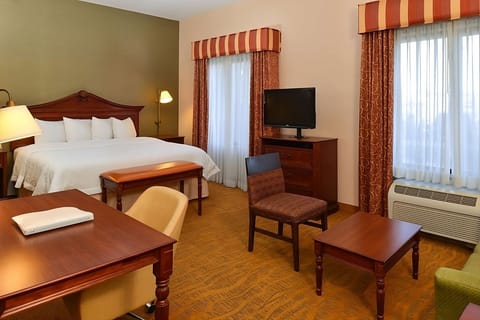 Arrive and relax in a spacious room with cozy seating.