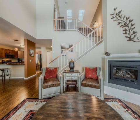 Bright living area with Smart TV, sofa sleeper, and gas fireplace