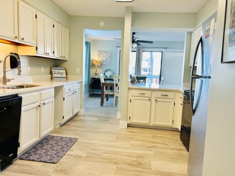Cook, laugh & feel at home in this bright kitchen with walk-in pantry