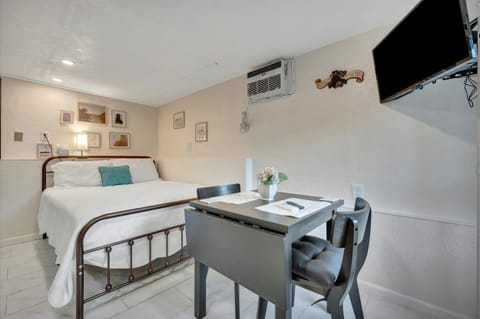 Open studio layout with sleeping and dining areas