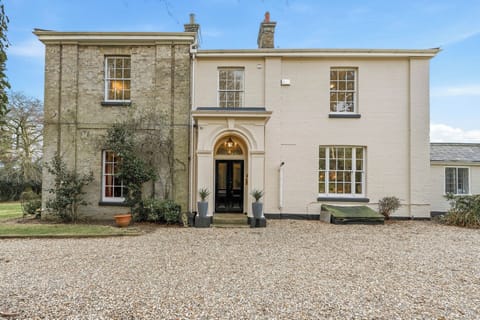 Grand entrance from Large gravel area with plenty of parking  for up to 5 cars.