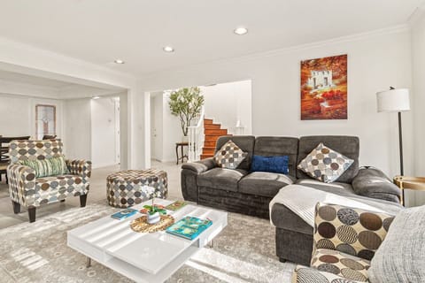 Spacious living room featuring a comfortable L-shaped sofa
