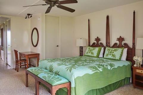 Unwind in a spacious bedroom with warm island-inspired furnishings.