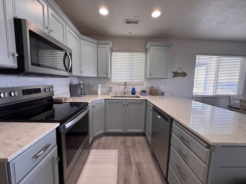 Bright, modern kitchen with spacious counters—perfect for cooking, gathering, and enjoying time together.