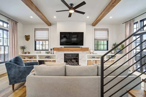 High end finishes and professional design choices are evident throughout this spacious communal area which flows into the kitchen. Large windows highlight the peaks while filling the room with bright Colorado sunshine.