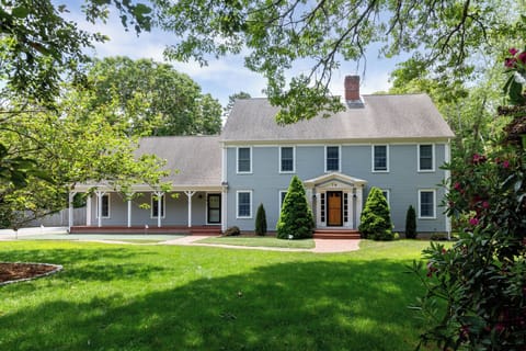 Another view of the expansive grounds, room for lawn games, dog play, and relaxing at this Cape Cod retreat.