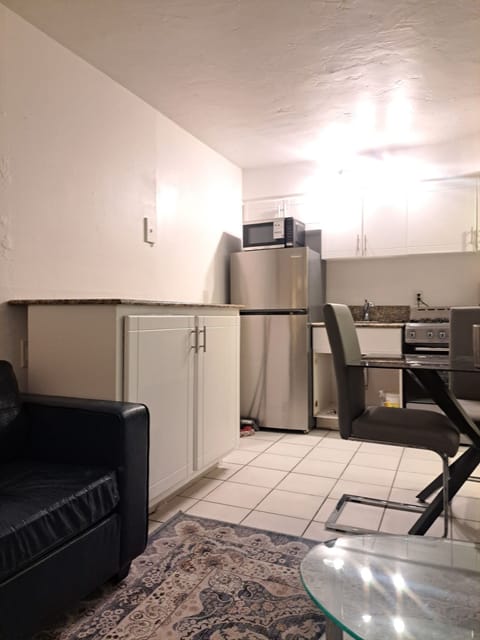 Kitchen with stainless steel appliances and granite prep area