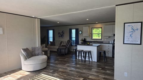 Sitting area with view of kitchen and living room