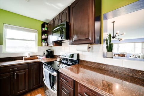 Fully stocked kitchen with coffee maker, bread maker, toaster coffee pods, tea.