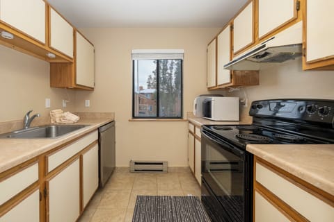 Your fully equipped galley kitchen features everything you need to create delicious meals, with ample counter space and natural light.