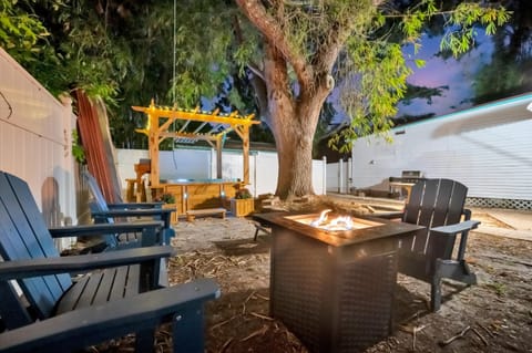 Fire pit setup with Adirondack seating for evening gatherings