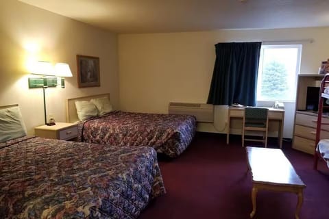 Settle into a spacious double-bed room with bright window light.