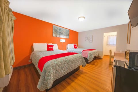 Unwind together in a spacious room with two comfy beds.