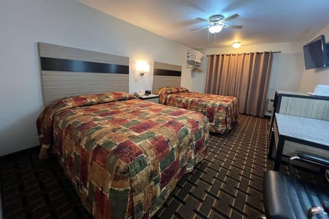 Relax in a bright, comfortable room with two inviting beds.