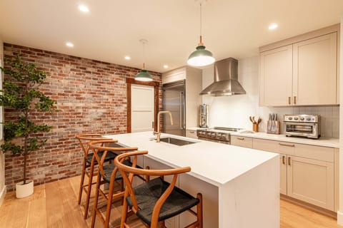 Chef's kitchen with island seating and premium appliances