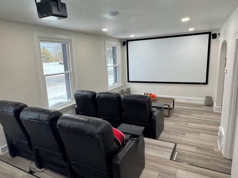 Settle into plush leather recliners and enjoy movie nights on your private cinema screen with professional projection system.