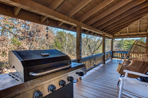 Relax in your wicker chair on this covered deck while your meal sizzles on the BBQ, surrounded by peaceful forest views.