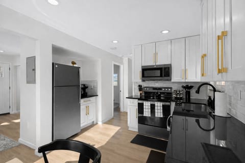 Modern, fully equipped kitchen with sleek appliances, generous counter space, and stylish finishes—perfect for cooking, meal prep, or enjoying a night in.