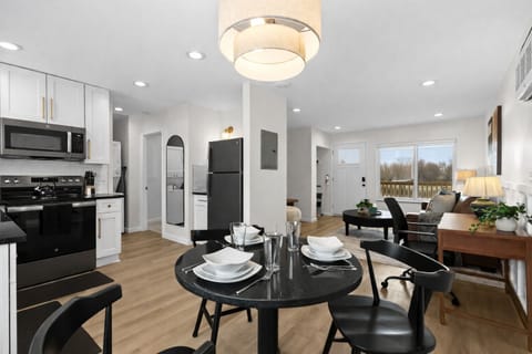 Stylish open-concept layout with modern kitchen, dining area, and cozy living spaceâideal for gathering, cooking, and unwinding with ease.