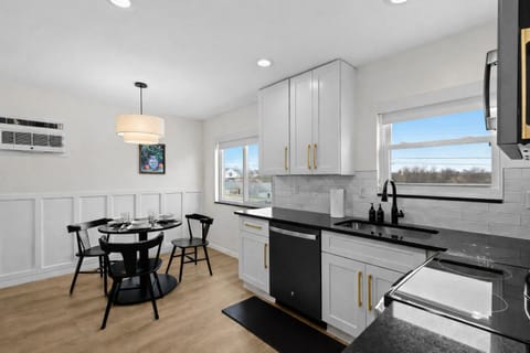 Bright kitchen and dining area with modern finishes, ample counter space, and natural lightâperfect for cooking, dining, and everyday comfort.