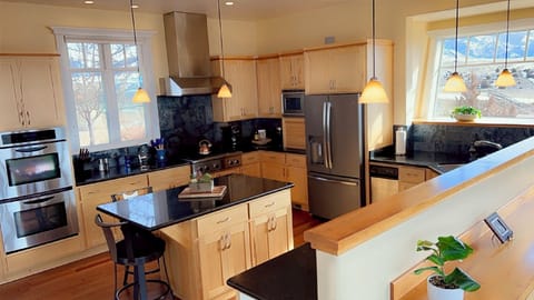 A cook's dream kitchen with plenty of large and small appliances.