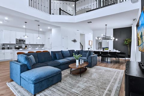 Bright open-concept living space – Perfect for gathering, relaxing, and movie nights. 