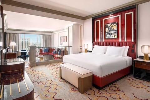 Unwind in a vibrant suite with crisp linens and city views.