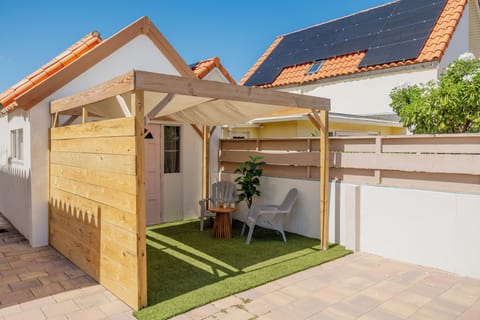 Private entrance with cozy outdoor seating