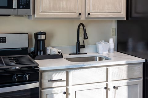 Full kitchen with breakfast bar and modern appliances