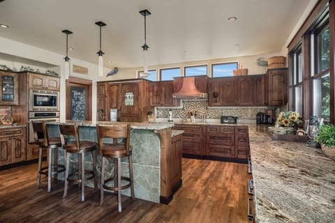 Kitchen with great counter tops and nice finishings. 