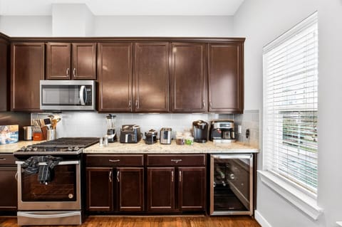 Keurig coffee machine + espresso machine with complimentary coffee, coffee pods, tea, sugar, cream, and sweetener