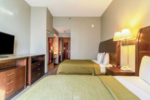 Stretch out in a spacious room with two comfy beds