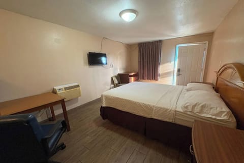 Arrive and recharge in a bright room with plush bedding.