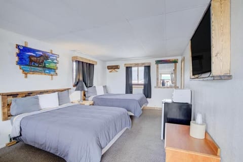 Gather everyone comfortably with two plush beds and relaxing space.