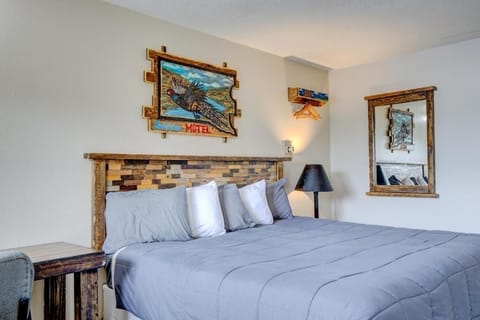 Sink into a plush king bed with rustic charm.