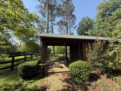 Private porch with swings and dining table.