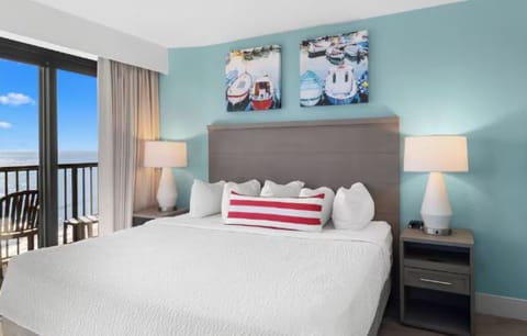 Wake up to ocean breezes from this serene king bed.