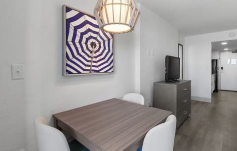Gather for easy meals and games beneath warm lighting.