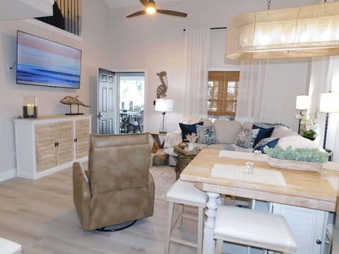 Bright and airy living room with cozy seating and ocean views