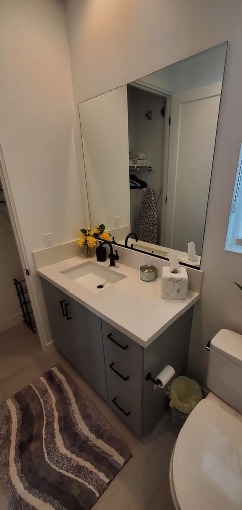 Charming bathroom with toiletries essentials provided.