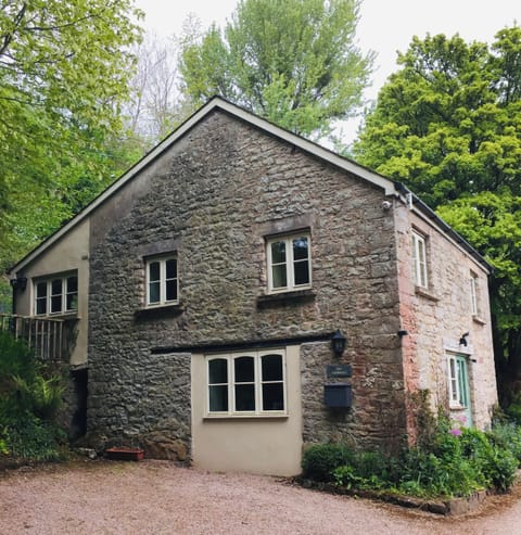 Guests park here then walk up steps to entrance at rear of cottage.
