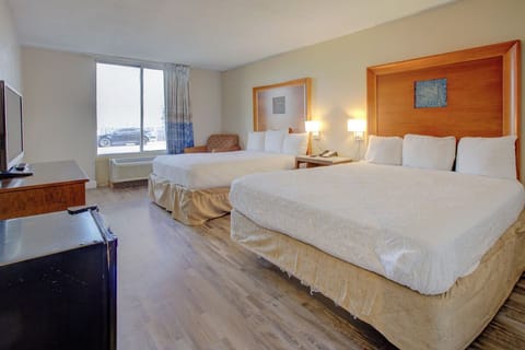 Unwind in bright double-queen comfort with easy natural light.