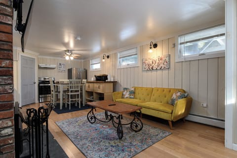 Kick back and relax in the open-concept space, filled with cozy seating and charming vintage touches.