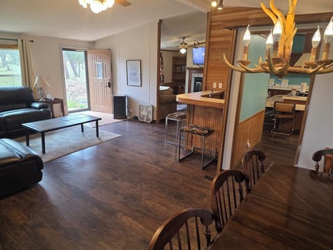 Dining area open to the living room and wet bar.