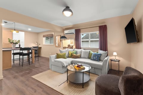 Open concept living, dining, and kitchen area. Step into comfort and luxury.