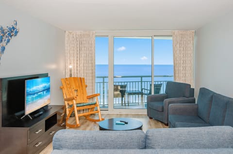 Bright living room with stunning ocean views and cozy seating.