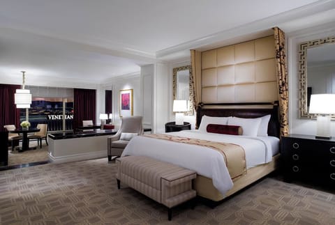 Recharge in a refined bedroom with a bright sitting area.