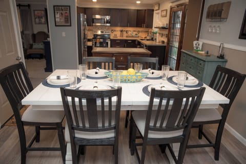 Enjoy family meals or game nights at our elegant dining table for six.