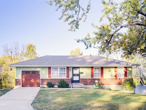 Charming street-front view with mature trees and easy curb access, offering a welcoming first impression.